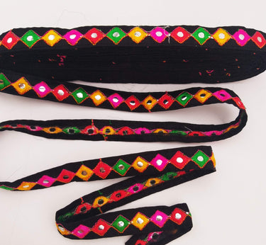 Wholesale Black Cotton Fabric Mirrored Trim With Embroidery In Yellow, Fuchsia Pink, Red & Green Threads
